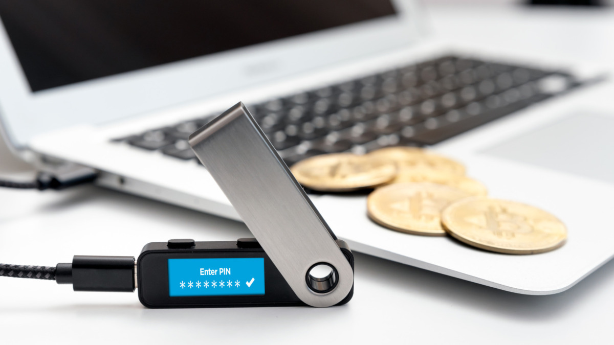 Saving cryptocurrency coins into secure digital wallet. Bitcoin secure wallet