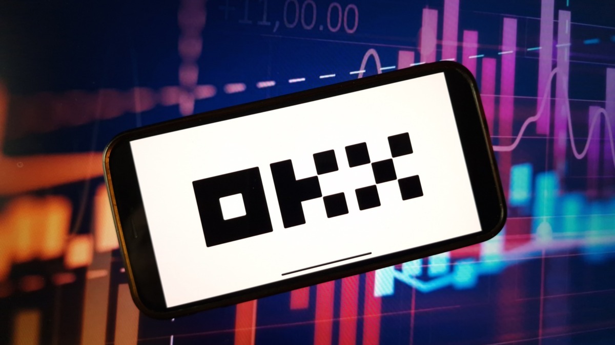 Konskie, Poland - January 05, 2024: OKX cryptocurrency exchange logo displayed on smartphone on crypto market data background