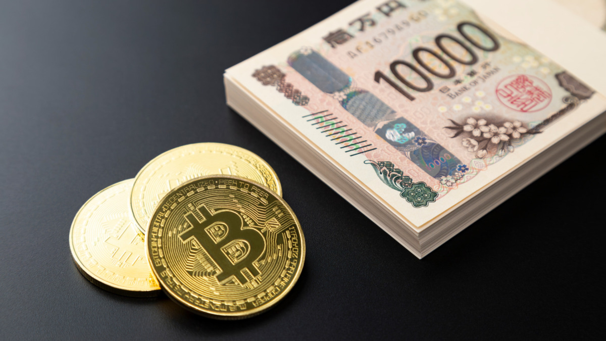 黒背景にビットコインと100万円