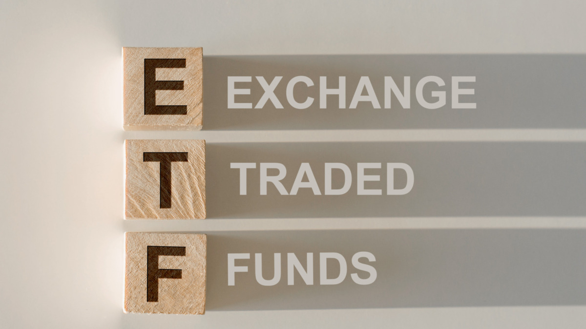 ETF - Exchange Traded Fund text on wooden cubes, on white background