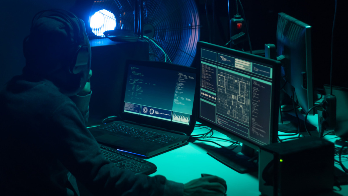 Hackers making cryptocurrency fraud using virus software and computer interface. Blockchain cyberattack, ddos and malware concept. Underground office background.