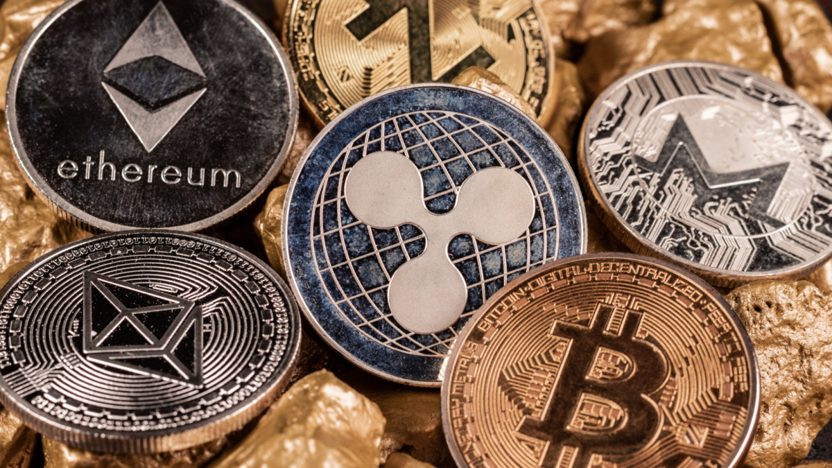 Bitcoin cryptocurrency and altcoins with gold nuggets. Investment and store of value concept.