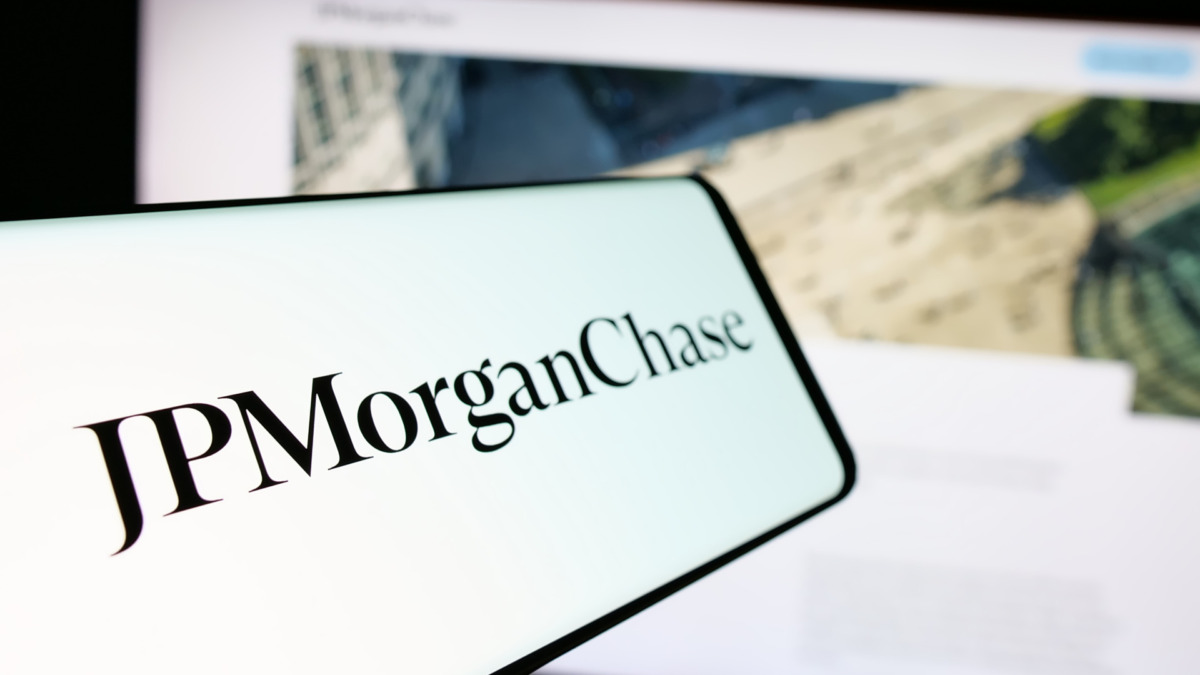 Stuttgart, Germany - 01-30-2025: Smartphone with logo of US financial services company JPMorgan Chase Co. on screen in front of website. Focus on center-left of phone display.