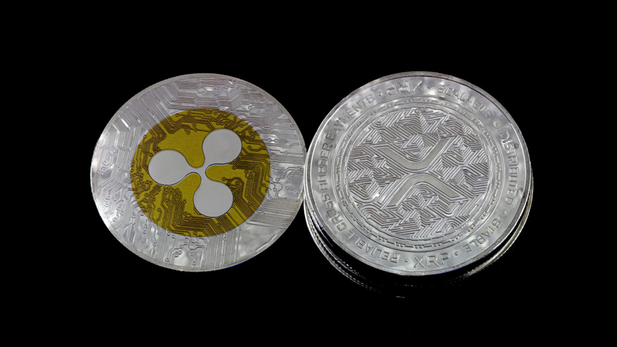 Cryptocurrencies XRP, Ripple on black background.