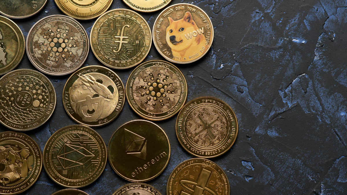 Variety of cryptocurrencies with dark textured background and view from above
