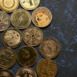 Variety of cryptocurrencies with dark textured background and view from above