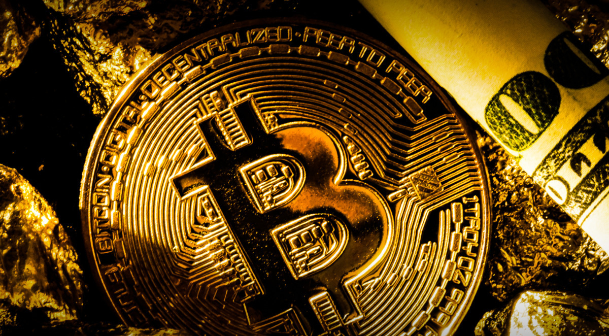 Golden bitcoin coin and mound of gold bitcoin cryptocurrency business concept