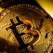 Golden bitcoin coin and mound of gold bitcoin cryptocurrency business concept
