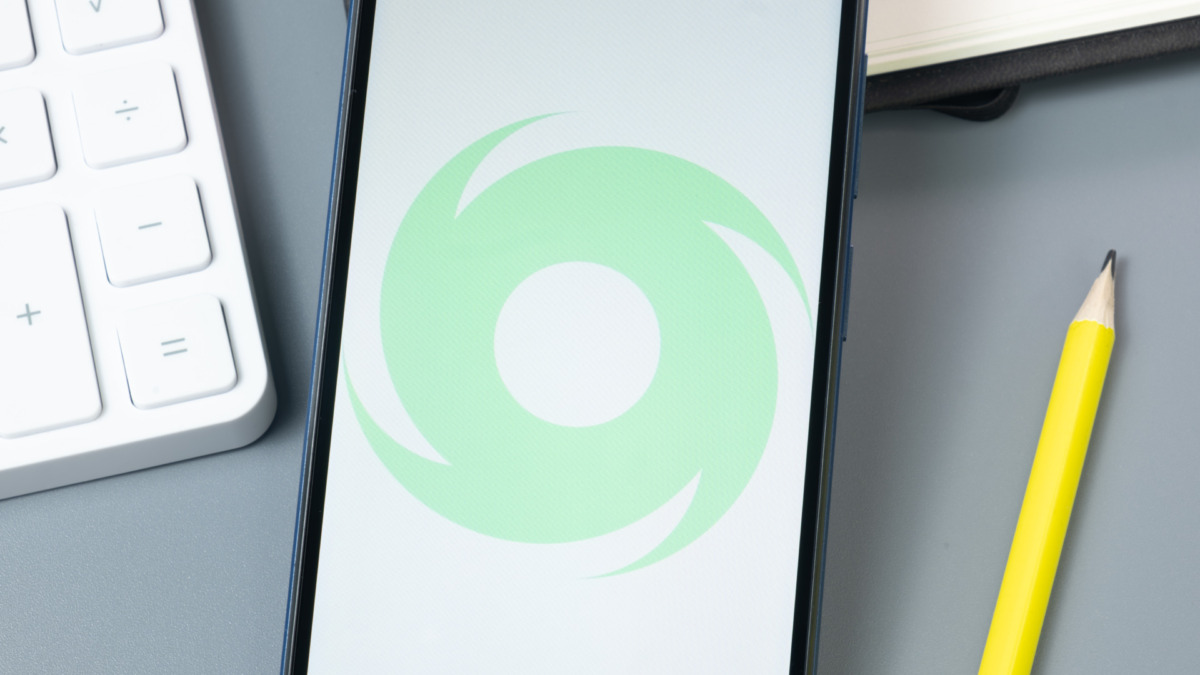 Tornado Cash TORN Logo on Phone Screen, Crypto Icon on Display.