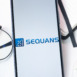 Sequans Communications Logo on Phone Screen, Company Icon on Display.
