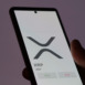 Close up on logo of XRP XRP on the screen of an exchange. XRP XRP price stocks, $XRP on a device.