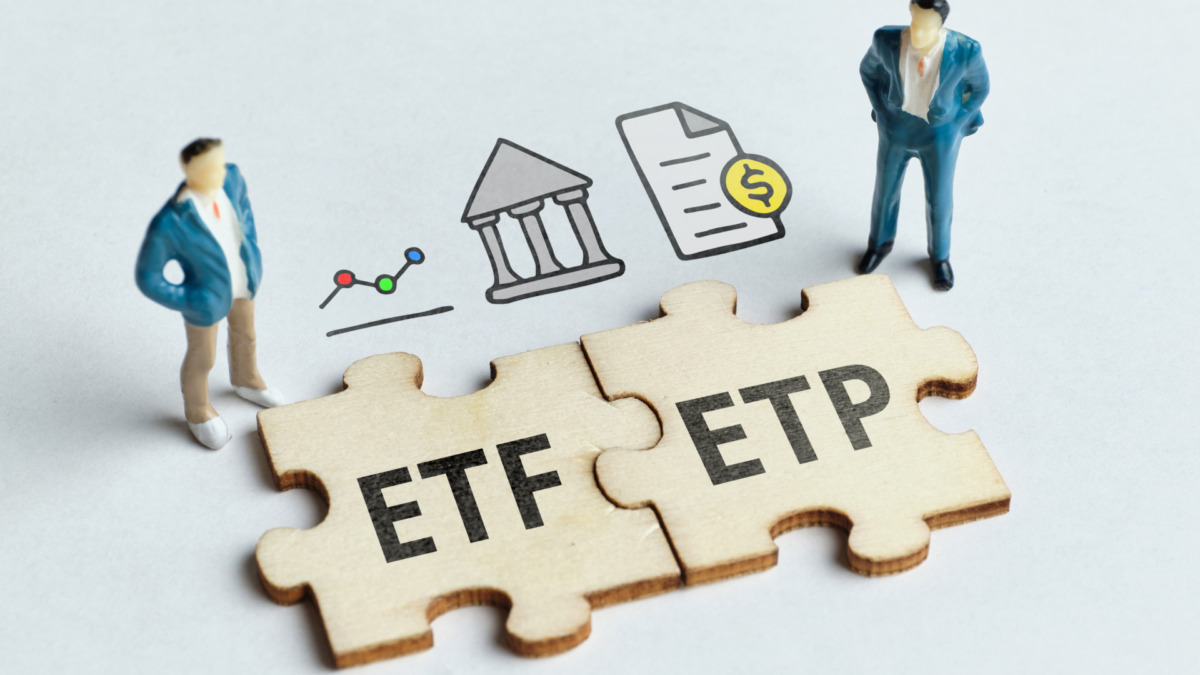 exchange-traded product ETP and exchange-traded fund ETF on a connected puzzle with businessmen.