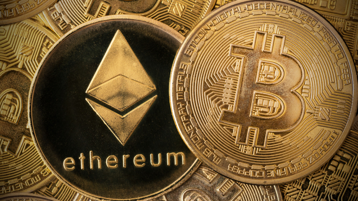 Ethereum and Bitcoin cryptocurrency coins. Digital currency in the blockchain concept technology