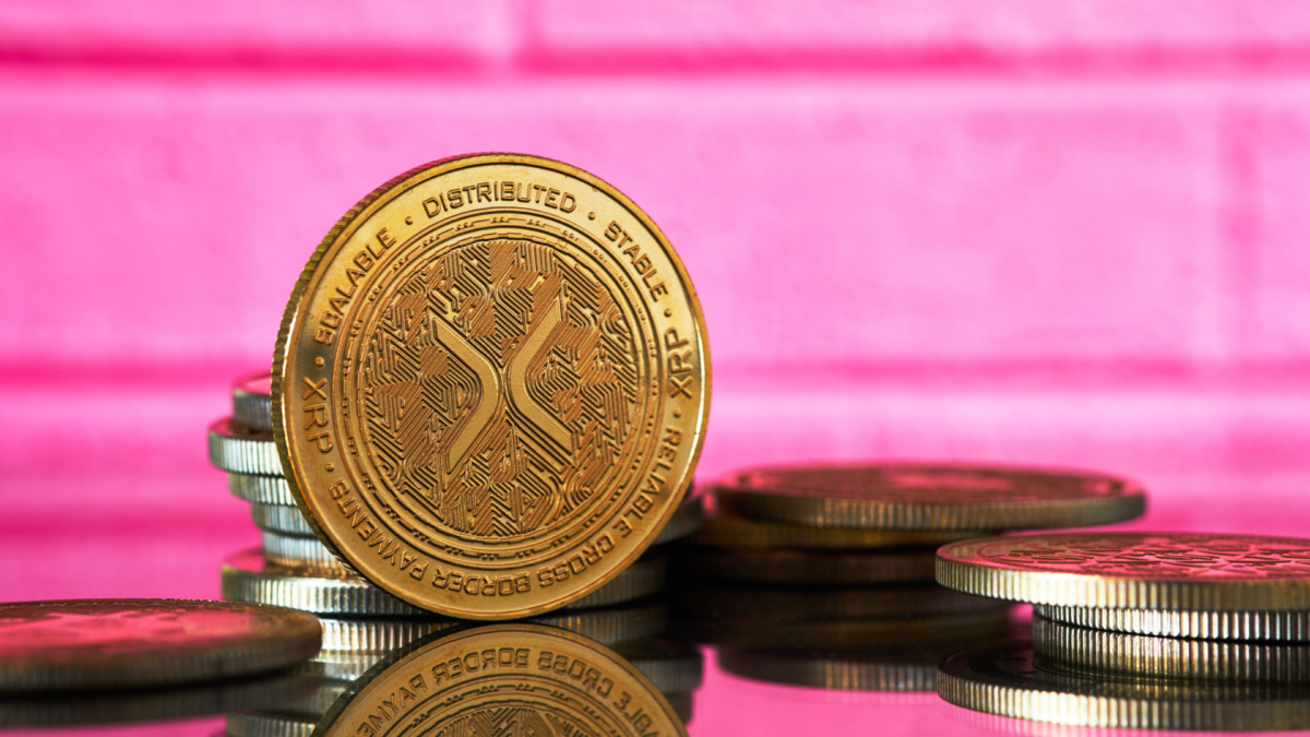 Closeup of golden Litecoin cryptocurrency surrounded by more coins