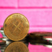 Closeup of golden Litecoin cryptocurrency surrounded by more coins