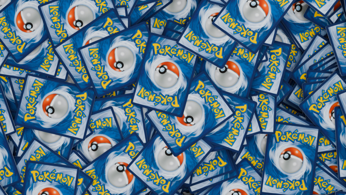 A pile of Pokemon Trading Cards, with the card backs showing, English TCG version