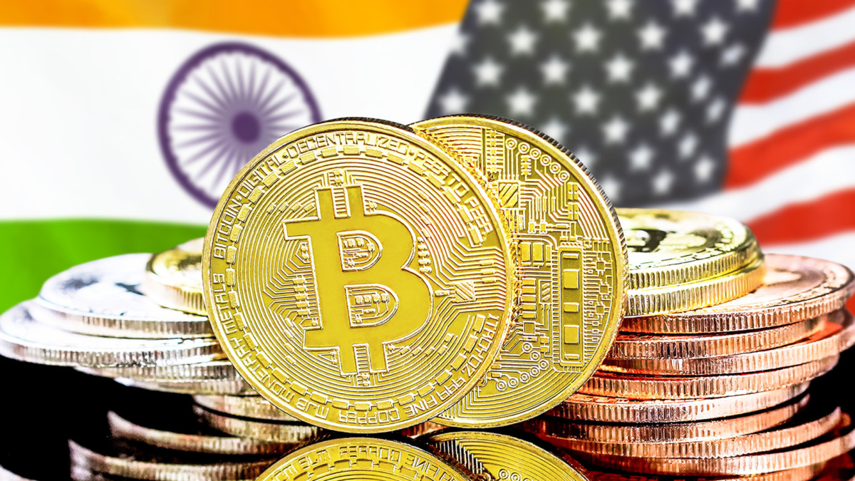 Concept for investors in cryptocurrency and Blockchain technology in the India and United States of America. Bitcoins on the background of the flag India and United States of America.