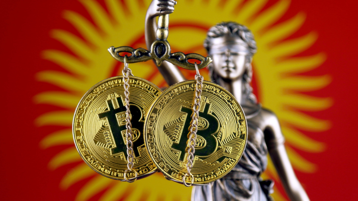 Symbol of law and justice, physical version of Bitcoin and Kyrgyzstan Flag. Prohibition of cryptocurrencies, regulations, restrictions or security, protection, privacy.