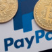 Bitcoin cryptocurrency on a paypal online payment logo.