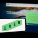 holding mobile phone with logo of Australian Bitcoin mining company Iris Energy Ltd. (IREN) in front of web page. Focus on phone display.