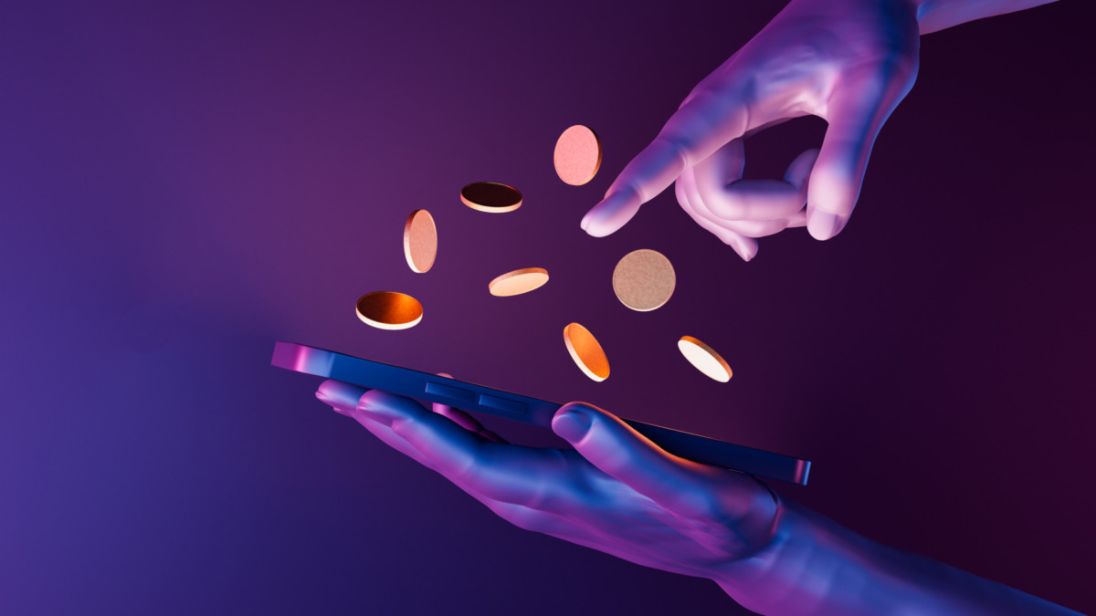 3d hands holding a cell phone with coins on the screen. neon lights. futuristic concept of play to earn, video games, technology, metaverse and crypto. 3d rendering