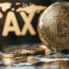 Golden Bitcoin coin with tax symbol, concept of crypto finance and taxation