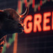 bull standing in front of rising market chart with shining word "greed". symbolizing strong increasing bull market with increased greed index. illustration for crypto bitcoin gold stock market chart