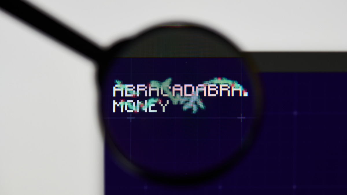 magic internet money - MIM website's hp. magic internet money, MIM coin logo visible through a loope. Defi, ntf, cryptocurrency concepts illustrative editorial.