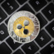 Ripple cryptocurrency, physical coin laying on a laptop keyboard