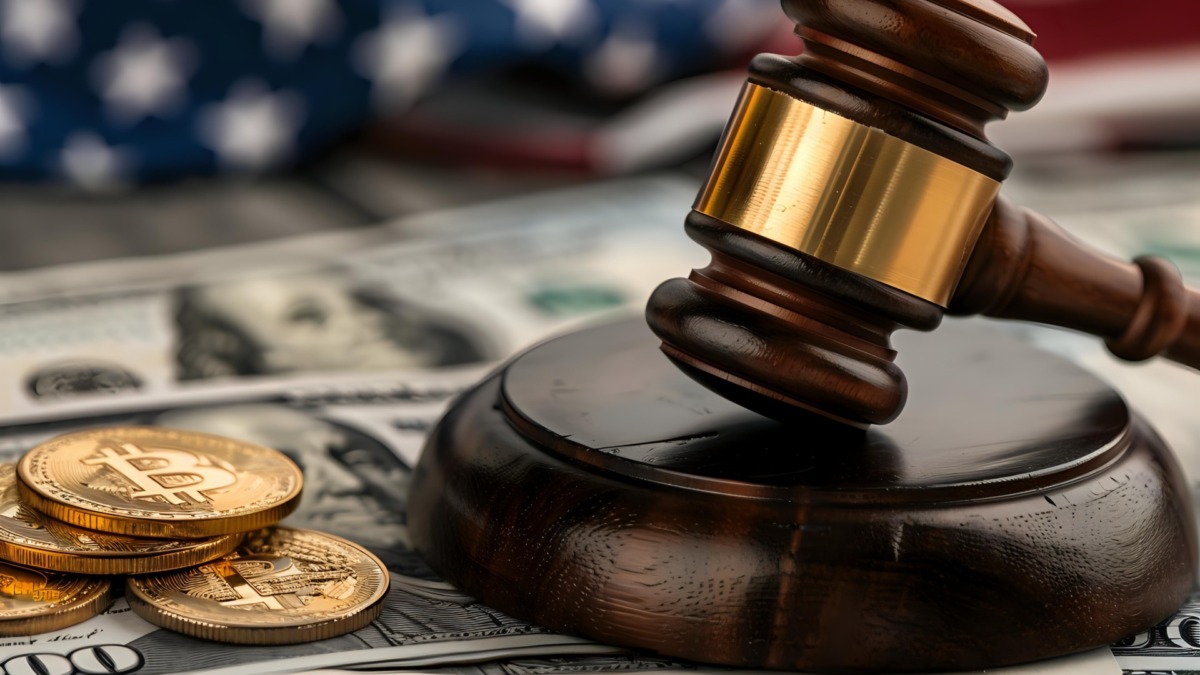 Legal regulation of cryptocurrency concept with judge gavel, bitcoin coins and US dollar banknotes against American flag background for financial law and digital currency policy.