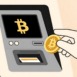 Hand inserts a golden Bitcoin coin into a digital cryptocurrency ATM, facilitating a modern financial transaction
