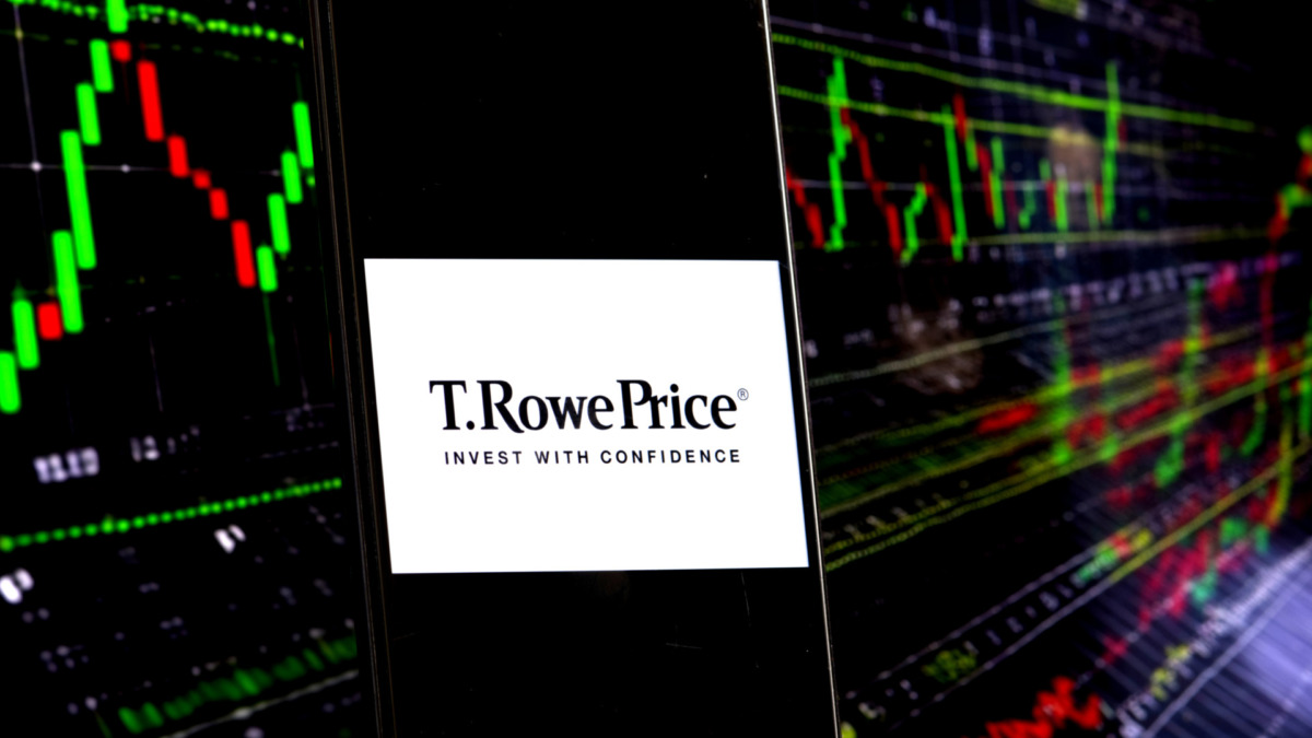 T. RowePrice company logo is seen displayed on a smartphone with a chart in the background.