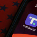 Truth Social app icon is seen on an iPhone. Truth Social is an alt-tech social media platform owned by Trump Media and Technology Group (TMTG).