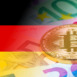 golden bitcoin metallic coin over euro banknotes with germany flag