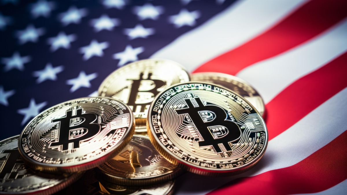 Golden bitcoin cryptocurrency coins lying on an american flag, representing the digital economy and cryptocurrency investment in the usa