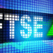 Financial Times Stock Exchange FTSE on the display banner with green arrow up, 3d rendering