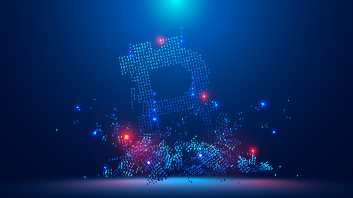 Bitcoin crash. Digital symbol of bitcoin falls to the bottom and is broken down into digital pieces. The collapse of bitcoin leads to disaster in the financial markets. Risks of cryptocurrency.