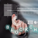 Man touching a blockchain concept on a touch screen with his finger