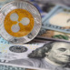 Ripple coin, XRP token, cryptocurrency on US 100 dollar background for design purpose