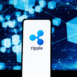 Ripple logo on phone screen stock image.