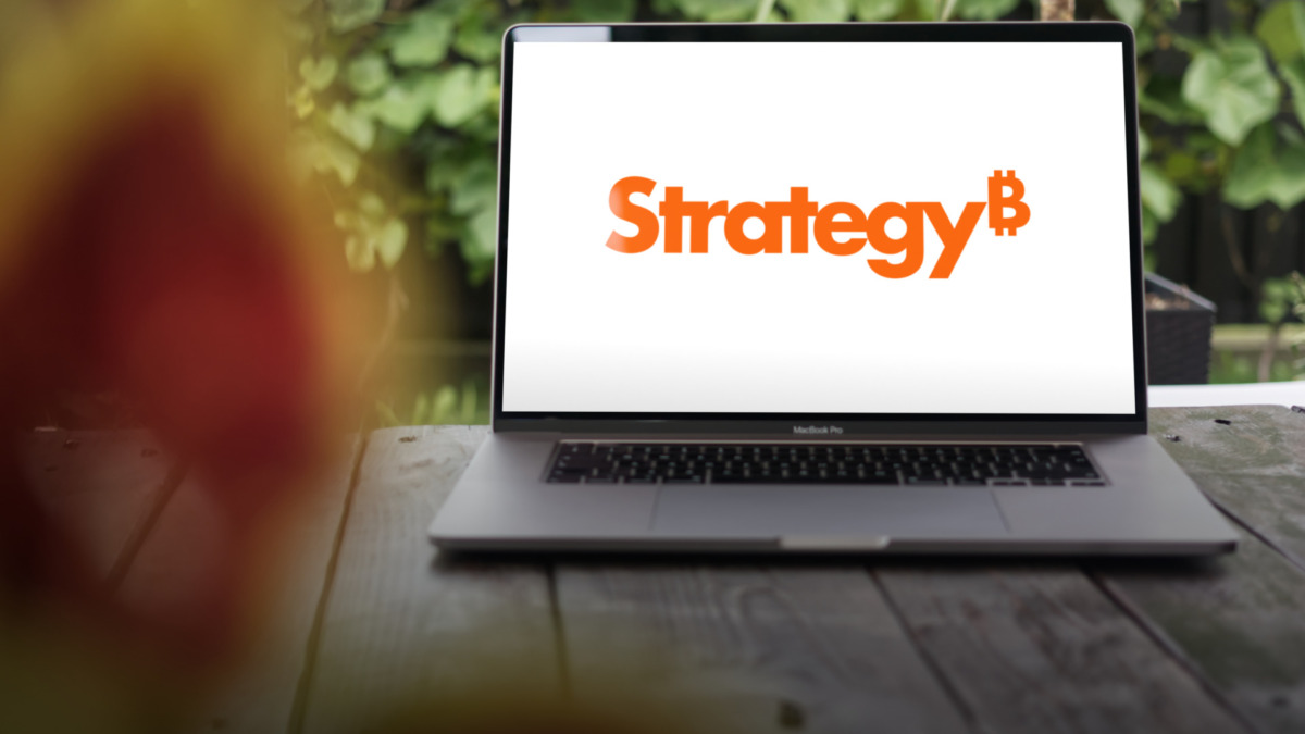 The new MicroStrategy (Strategy Inc.) logo shown on a MacBook Pro screen, representing innovation and modern business technology.