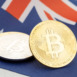 Bitcoin cryptocurrency coins on national flag of Australia. Crypto law regulation concept