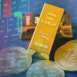 Bitcoin and Gold trading, gold bars on table with stock graph chart stock market trade background, pile of gold bars financial business economy concepts, wealth success in business and finance