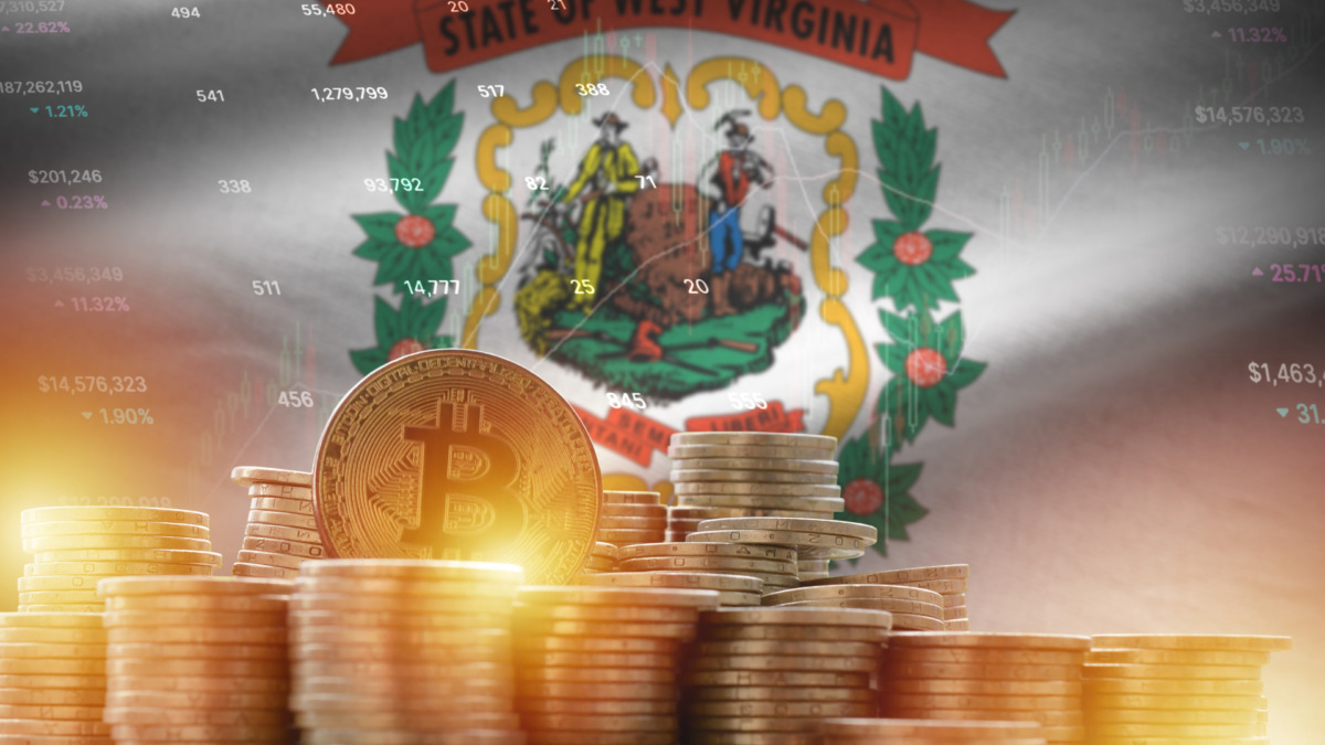 West Virginia US state flag and big amount of golden bitcoin coins and trading platform chart. Crypto currency concept