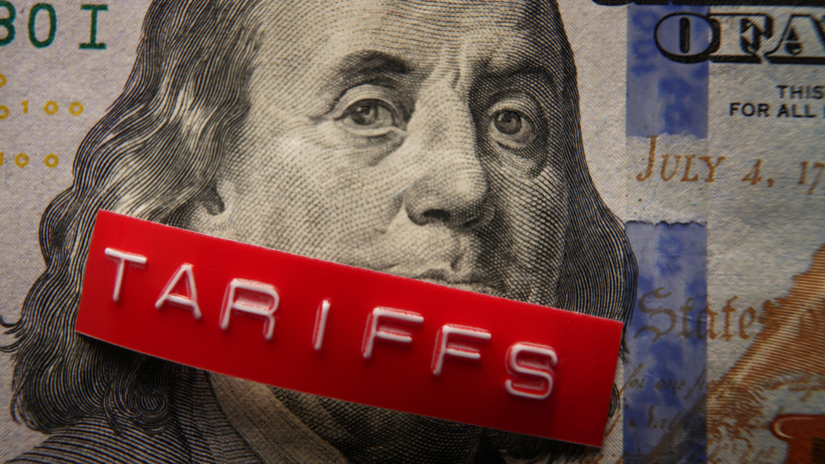Red Tariffs label on a hundred dollar bill