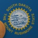 Gold Bitcoin in the Bottom Left Corner on the US State Flag of South Dakota