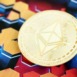 KYIV, UKRAINE - OCTOBER 9, 2025 Ethereum cryptocurrency coin sticker on hexagonal abstract banner. Concept of modern crypto money
