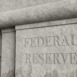 Retro style concrete wall engraved with the word FEDERAL RESERVE. Illustration of the concept of the issues and affairs related to federal reserve.