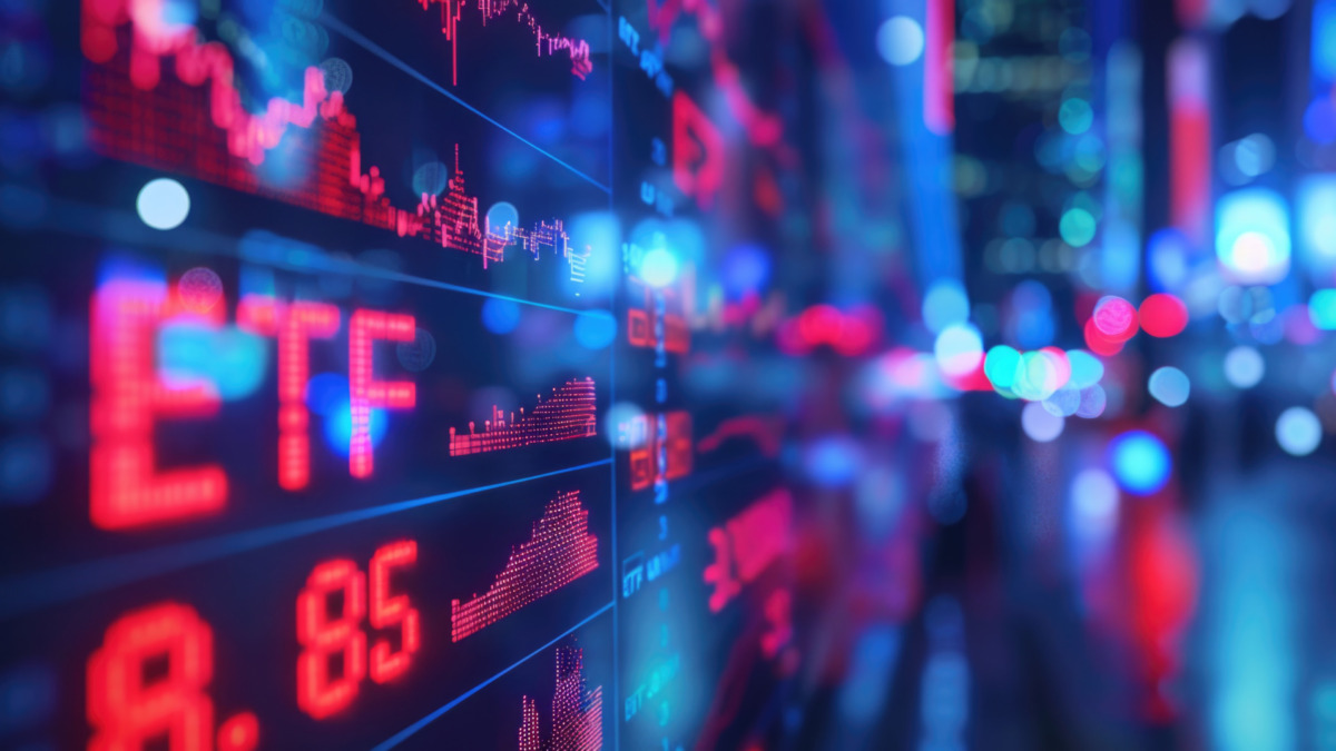 ETF glowing text on blurred background. Business, finance, crypto currency market concept