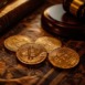 A captivating arrangement of Bitcoin coins alongside a wooden gavel and an antique book, symbolizing the intersection of cryptocurrency and law.